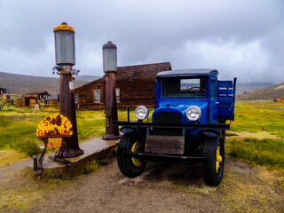 color photography of an old truck at a gas station