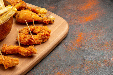 Fried chicken menu with onion rings on mixed color background
