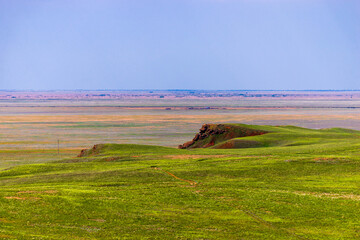 View of the salty lake Baskunchak. A stone similar to the head of an animal or an ancient man....