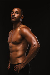 Fototapeta na wymiar Portrait of a bare chested fit athlete