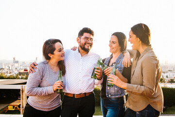 Group of Hispanic friends having party on rooftop in Mexico
