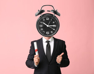 Young man with alarm clock instead of head and diploma on color background. Time management concept