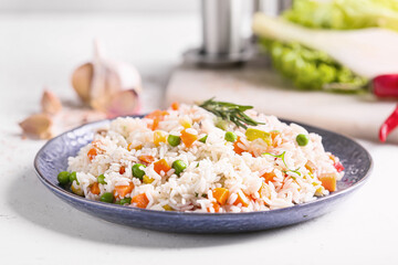 Plate with tasty pilaf on table