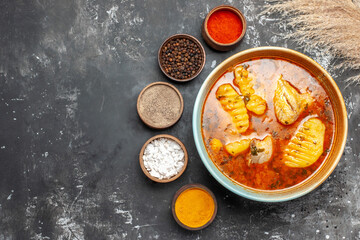 Homemade soup with chicken and spices set on the left corner