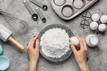 Woman preparing bakery on table, top view