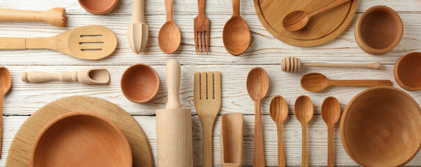 Pattern of wooden dishes on white wooden table