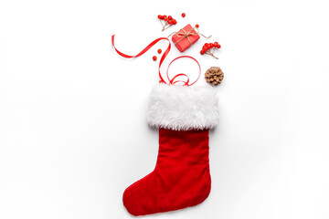 Composition with Christmas sock on white background