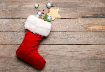 Obraz na płótnie Canvas Composition with Christmas sock on wooden background