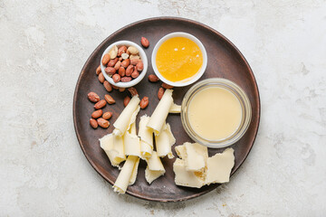 White chocolate with honey and nuts on grunge background
