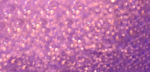 Shiny purple background round sequins blurred Defocused