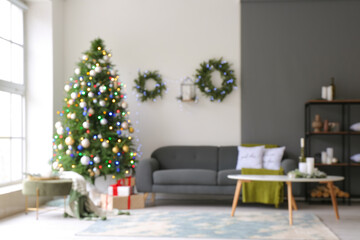 Interior of living room decorated for Christmas, blurred view