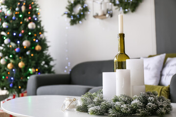 Candles in interior of living room decorated for Christmas