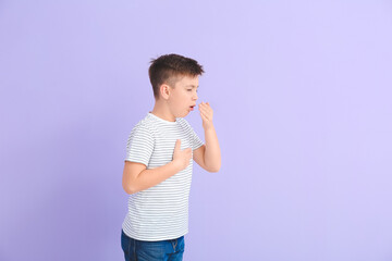 Coughing little boy on color background