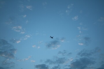 A small  plane in the sky in August