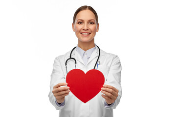 medicine, healthcare and cardiology concept - smiling female doctor with red heart and stethoscope