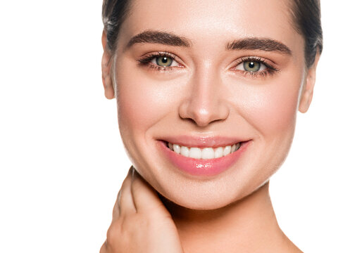 Beautiful woman face with healthy teeth smile natural make up healthy skin and beautiful eyes