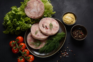 Homemade headcheese with dill and mustard, and cherry tomatoes