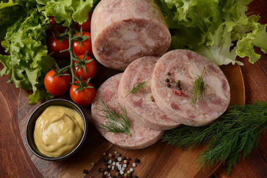 Homemade headcheese with dill and mustard, and cherry tomatoes