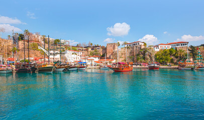 Tourists enjoying sea journey on sail yacht - Old town "Kaleici" -Antalya, Turkey 