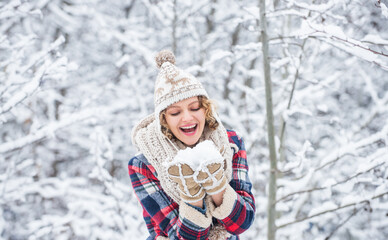 Fototapeta premium Winter admirer. Favorite season. Walk in snowy forest. Happy girl having fun outdoors. Christmas time. Winter outfit. Woman wear warm accessories stand in snowy nature. Winter fashion collection