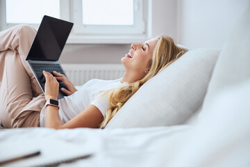 Close up of sincere woman laughing at joke