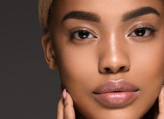 African american woman looking camera face close up beauty skin