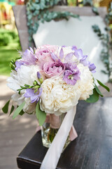 Wedding flowers, beautiful peonies bridal bouquet. Decoration made of peonies and decorative plants