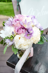 Wedding flowers, beautiful peonies bridal bouquet. Decoration made of peonies and decorative plants