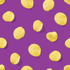 Seamless pattern made from Potato chips on purpule background flat lay. potato snack chips isolated Fast food banner.