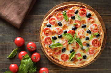 Homemade pizza with tomato and olives