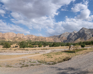 Scenic mountain landscape with small shrine in Mazar-i-Sharif countryside near Panjakent in Sughd region of Tajikistan
