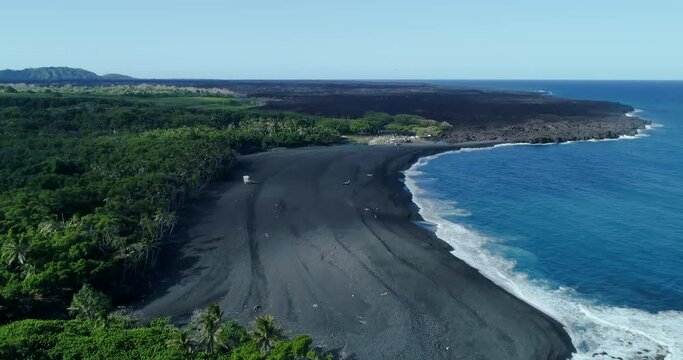 4k forward tracking from water to beach aerial view of Punaluu beach,The beach has black sand made of basalt and created by lava flowing into the ocean,big island,hawaii,usa
