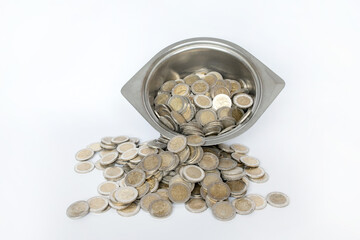 Dirty coins in a metal bowl. White background. Lithuanian money