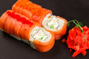 Japanese food: Set of different salmon sushi and rolls