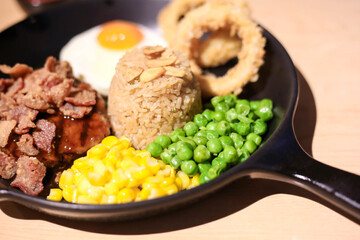 Griled chicken breast steak with  rice and onions,corns,Green peas vegetable,soft focus