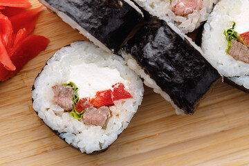 Maki sushi roll served on plate close up