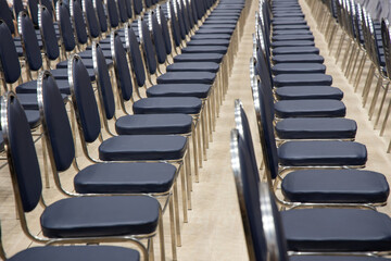 Empty chairs rows in the seminar hall. Place of meeting event or committee concept.