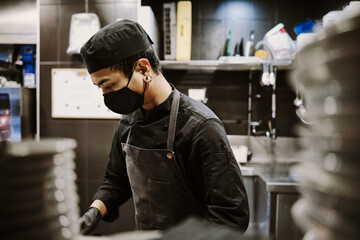 Chef man working at kitchen.