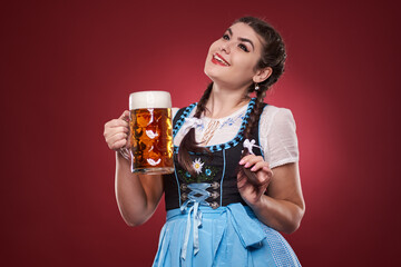 Young woman with a pint of beer