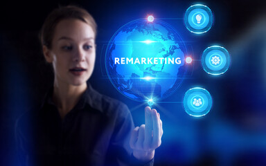 Business, Technology, Internet and network concept. Young businessman working on a virtual screen of the future and sees the inscription: Remarketing