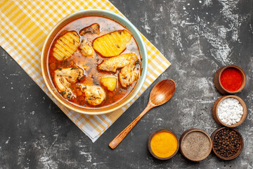 Above view of mouth-watering chicken soup with five various spices