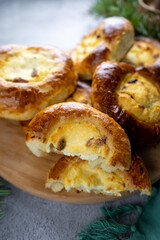 Traditional Russian baking pastry vatrushka, round buns, curd tart selective focus, closeup. Cheesecake with cottage cheese. Rustic food Photography.