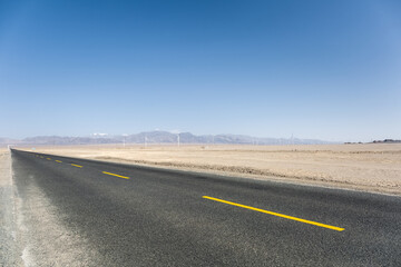 asphalt road on the gobi desert