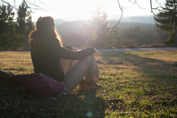 Woman in nature in sunset. People in nature.