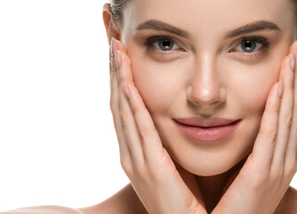 Beautiful woman face hands touching cheeks with healthy clean beauty skin close up