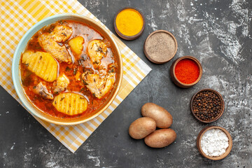 Above view of spices set chicken soup and potatoes