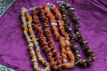 Set of mineral stones as amethyst, rhinestone, coral, lapis lazuli , woman accessorize