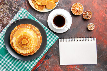 Pumpkin pie pancake mix a cup of tea and notebook