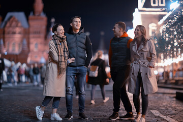 Fototapeta premium red square evening winter, a group of friends for a walk new year christmas moscow russia