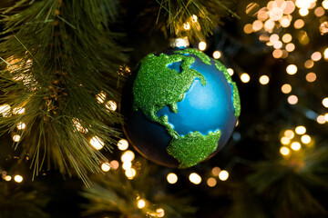 Close-up of Christmas bauble decoration ornament globe planet earth  on the background of the...